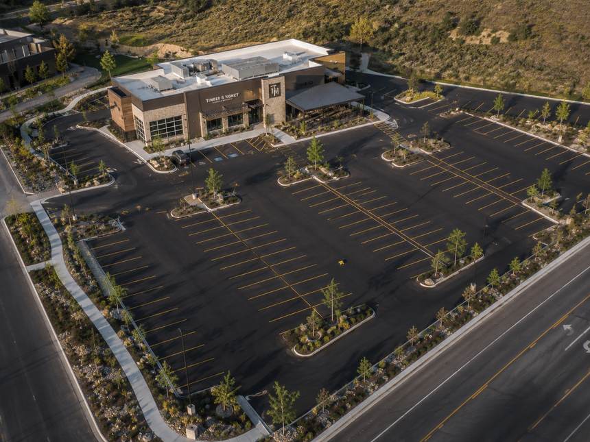 Aerial of a restaurant parking lot with fresh striping in the foothills